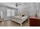 Comfortable bedroom features a well-lit space, a stylish bed with decorative pillows, and a cozy ambiance for relaxation at 4128 Boxwood Way, Duluth, GA 30096