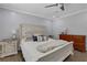 Charming bedroom featuring a well-lit space, a stylish bed with decorative pillows, and a cozy ambiance for relaxation at 4128 Boxwood Way, Duluth, GA 30096