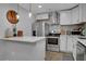 Modern kitchen with stainless steel appliances and a stylish backsplash at 4128 Boxwood Way, Duluth, GA 30096
