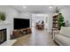 Spacious living area with hardwood floors and seamless flow to dining space at 4128 Boxwood Way, Duluth, GA 30096