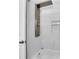 Modern shower equipped with sleek fixtures, a handheld sprayer, and built-in shelving for a luxurious showering experience at 4128 Boxwood Way, Duluth, GA 30096