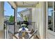 Quaint balcony featuring an outdoor seating set and view of the neighborhood at 6065 Cushing Cir, Norcross, GA 30071