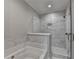 Bright bathroom featuring a soaking tub and separate shower with elegant white marble tiling at 6065 Cushing Cir, Norcross, GA 30071