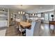 Open floor plan featuring dining area, hardwood floors, custom shelving, and seamless flow to kitchen at 6065 Cushing Cir, Norcross, GA 30071