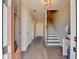 Inviting home foyer with hardwood floors, elegant staircase, and stylish decor at 6065 Cushing Cir, Norcross, GA 30071