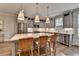 Beautiful kitchen with quartz countertop island, stainless steel appliances, and hardwood flooring at 6065 Cushing Cir, Norcross, GA 30071