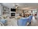 Bright and spacious living room with hardwood floors, a fireplace, and open access to the dining area at 6065 Cushing Cir, Norcross, GA 30071