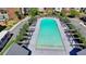 Aerial view of community pool surrounded by lounge seating and lush landscaping, perfect for relaxation at 6065 Cushing Cir, Norcross, GA 30071