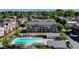 Aerial view of townhomes and pool with lounge seating, offering a luxurious community experience at 6065 Cushing Cir, Norcross, GA 30071