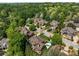 Aerial view of a neighborhood with mature trees and well-maintained lawns at 841 Camden Park Ne Ct, Atlanta, GA 30342