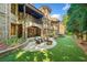 Brick home with an outdoor patio, manicured landscaping, and outdoor fireplace at 841 Camden Park Ne Ct, Atlanta, GA 30342