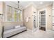 Elegant bathroom showcasing a comfortable bench, natural light, and walk-in shower at 841 Camden Park Ne Ct, Atlanta, GA 30342