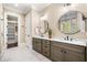 Bathroom with dual sinks, granite countertops, and plenty of cabinet space at 841 Camden Park Ne Ct, Atlanta, GA 30342