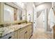 Bathroom featuring a granite countertop, decorative fixtures, and tiled floors at 841 Camden Park Ne Ct, Atlanta, GA 30342
