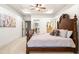 Well-lit primary bedroom suite featuring a large bed, ensuite, and artwork at 841 Camden Park Ne Ct, Atlanta, GA 30342
