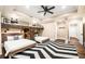 Bright bedroom boasting a built-in bunk bed, hardwood floors, and modern finishes at 841 Camden Park Ne Ct, Atlanta, GA 30342