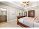 Bright bedroom with ensuite bathroom, walk-in closet, and carpet flooring at 841 Camden Park Ne Ct, Atlanta, GA 30342