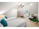 Bright bedroom with vaulted ceiling, two beds, and a cozy sitting area at 841 Camden Park Ne Ct, Atlanta, GA 30342