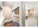 Walk-in closet with custom shelving, ample storage, and hardwood floors at 841 Camden Park Ne Ct, Atlanta, GA 30342