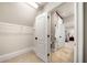 Walk-in closet with shelving and doorway view to a bedroom and bathroom at 841 Camden Park Ne Ct, Atlanta, GA 30342