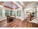 Dining area with bay window, hardwood floors, copper ceiling and chandelier at 841 Camden Park Ne Ct, Atlanta, GA 30342