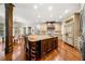 Spacious kitchen with a large island, stainless steel appliances, and hardwood floors at 841 Camden Park Ne Ct, Atlanta, GA 30342