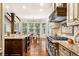 Gourmet kitchen with granite countertops, stainless steel appliances, and a breakfast nook at 841 Camden Park Ne Ct, Atlanta, GA 30342