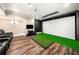 Home theater with large screen, comfortable seating and hardwood floors at 841 Camden Park Ne Ct, Atlanta, GA 30342
