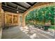 Covered brick patio perfect for outdoor lounging and entertaining guests at 841 Camden Park Ne Ct, Atlanta, GA 30342