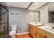 Updated bathroom featuring double sinks, tile floors, a glass shower, and modern fixtures, providing a luxurious experience at 900 Crossfire Nw Rdg, Marietta, GA 30064