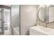 Bathroom with single vanity, chrome faucet, and shower with grey tile surround at 900 Crossfire Nw Rdg, Marietta, GA 30064