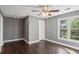 Bright bedroom with hardwood flooring, neutral walls, a ceiling fan, and ample natural light at 900 Crossfire Nw Rdg, Marietta, GA 30064