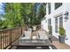 Inviting deck with outdoor seating, a fire pit, and views of the surrounding greenery perfect for relaxation and entertainment at 900 Crossfire Nw Rdg, Marietta, GA 30064