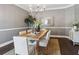 Traditional dining room featuring a rustic wooden table, chandelier, and neutral color palette at 900 Crossfire Nw Rdg, Marietta, GA 30064