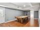 Recreational game room with a vintage pool table, wood-look flooring, and natural light creates an inviting entertainment space at 900 Crossfire Nw Rdg, Marietta, GA 30064