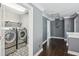 Well-appointed laundry room boasts modern appliances and stylish tile floors for a functional and aesthetically pleasing space at 900 Crossfire Nw Rdg, Marietta, GA 30064