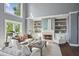 Comfortable living room featuring built-in bookshelves, a fireplace, and neutral décor at 900 Crossfire Nw Rdg, Marietta, GA 30064