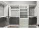 Spacious walk-in closet with custom white shelving and ample storage space at 900 Crossfire Nw Rdg, Marietta, GA 30064