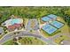Aerial view showcases community amenities including pool, clubhouse, tennis and pickleball courts at 2315 Saddle Brook Trce, Cumming, GA 30040