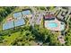 An aerial view of community amenities featuring tennis courts, pool, playground and clubhouse at 2315 Saddle Brook Trce, Cumming, GA 30040