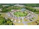 A beautiful aerial view of the neighborhood featuring a green space and sidewalks, homes, and amenities at 2315 Saddle Brook Trce, Cumming, GA 30040