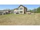 Spacious backyard featuring a patio and well-maintained lawn at 2315 Saddle Brook Trce, Cumming, GA 30040