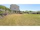 Large grassy backyard with landscaped accents, offering ample space for recreation and relaxation at 2315 Saddle Brook Trce, Cumming, GA 30040
