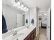 Bathroom featuring double vanity with a view to the bedroom at 2315 Saddle Brook Trce, Cumming, GA 30040