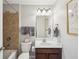 Cozy bathroom featuring a tiled shower, vanity with sink, and neutral paint for a refreshing space at 2315 Saddle Brook Trce, Cumming, GA 30040