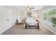 Inviting bedroom with a large window, closet and neutral colored carpet at 2315 Saddle Brook Trce, Cumming, GA 30040