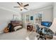 Bright bedroom features a piano, windows, and desk, creating a versatile living and workspace at 2315 Saddle Brook Trce, Cumming, GA 30040