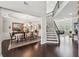 Elegant dining room boasts hardwood floors and detailed trim work near the staircase at 2315 Saddle Brook Trce, Cumming, GA 30040