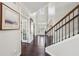 Bright foyer with hardwood floors, high ceiling and staircase leading to the upper level at 2315 Saddle Brook Trce, Cumming, GA 30040