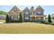 Beautiful two-story home with brick facade and manicured front yard at 2315 Saddle Brook Trce, Cumming, GA 30040